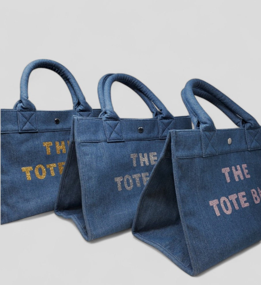 ClaraNY Washed Denim Book tote with "The Tote Bag" lettering include shoulder strap